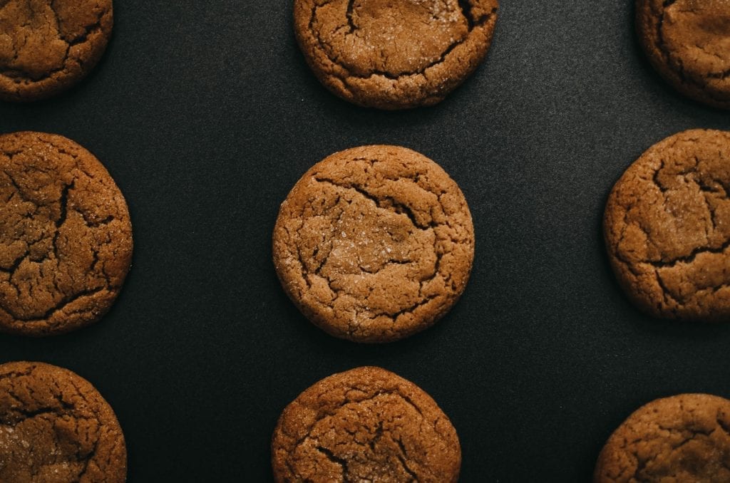 Cannabis infused peanut butter cookies sitting on a black table. Used in some of the best weed recipes.