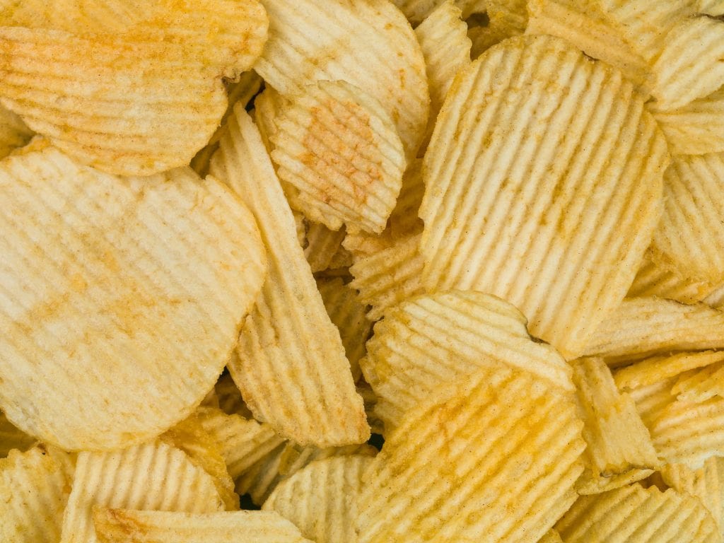 macro of weed potato chips piled on top of each other