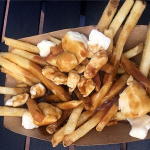 Overhead shot of weed poutine poutine has lots of gravy and cheese curds on it